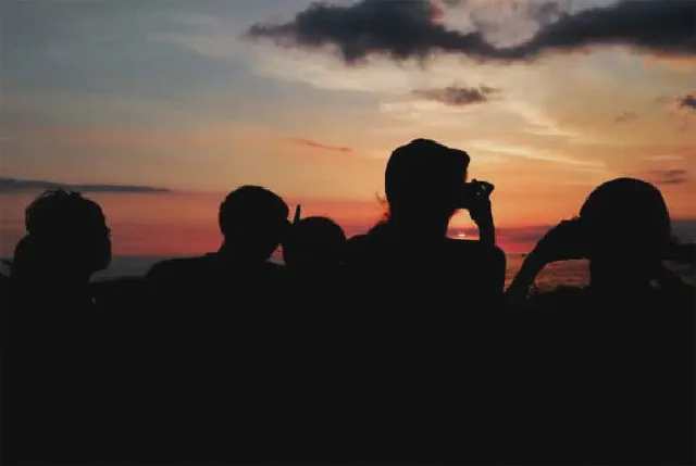 A family enjoying sunset